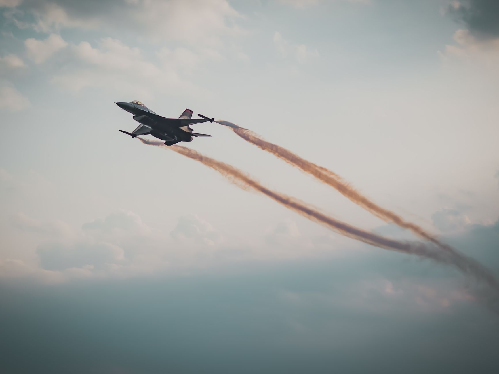 gray jet plane in mid air