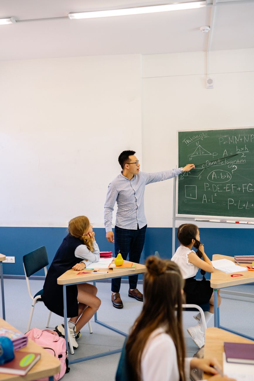 man pointing on a blackboard